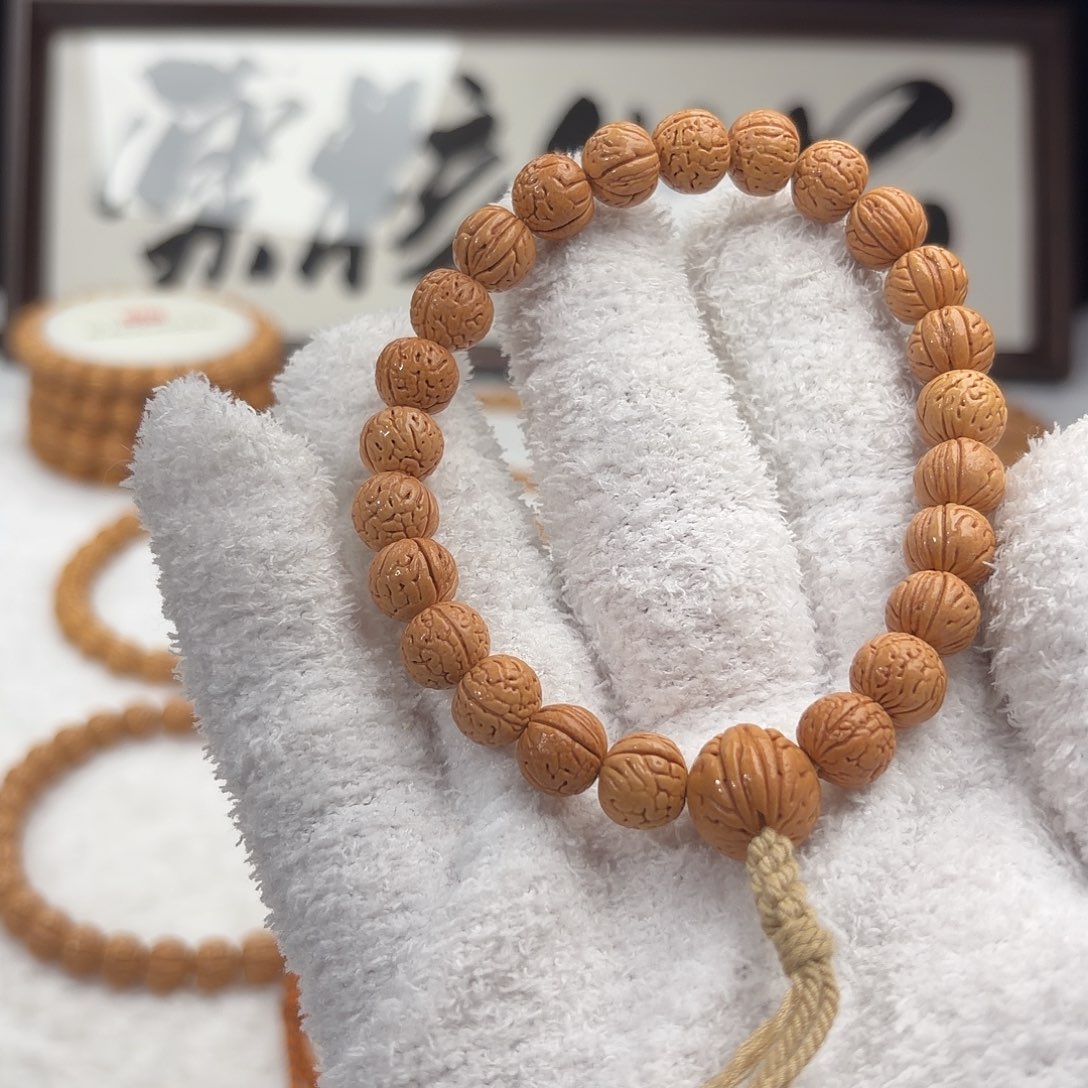 一***过桃核手串0.9加「肌肉小奶豆」野生桃核手持