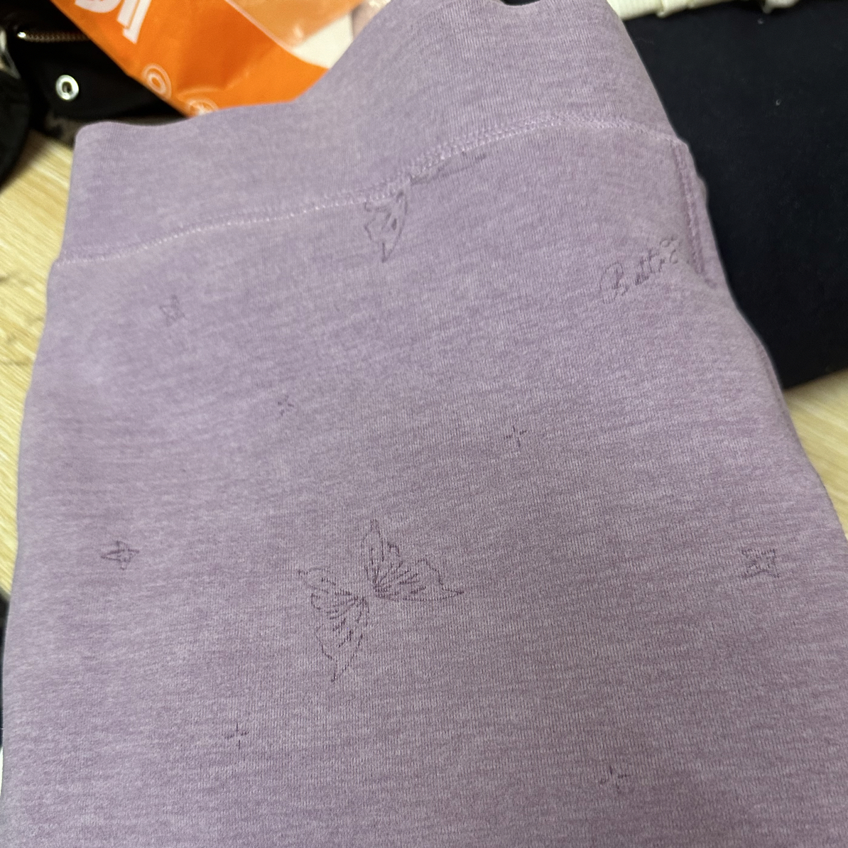 女士紫色绵羊毛裤一条