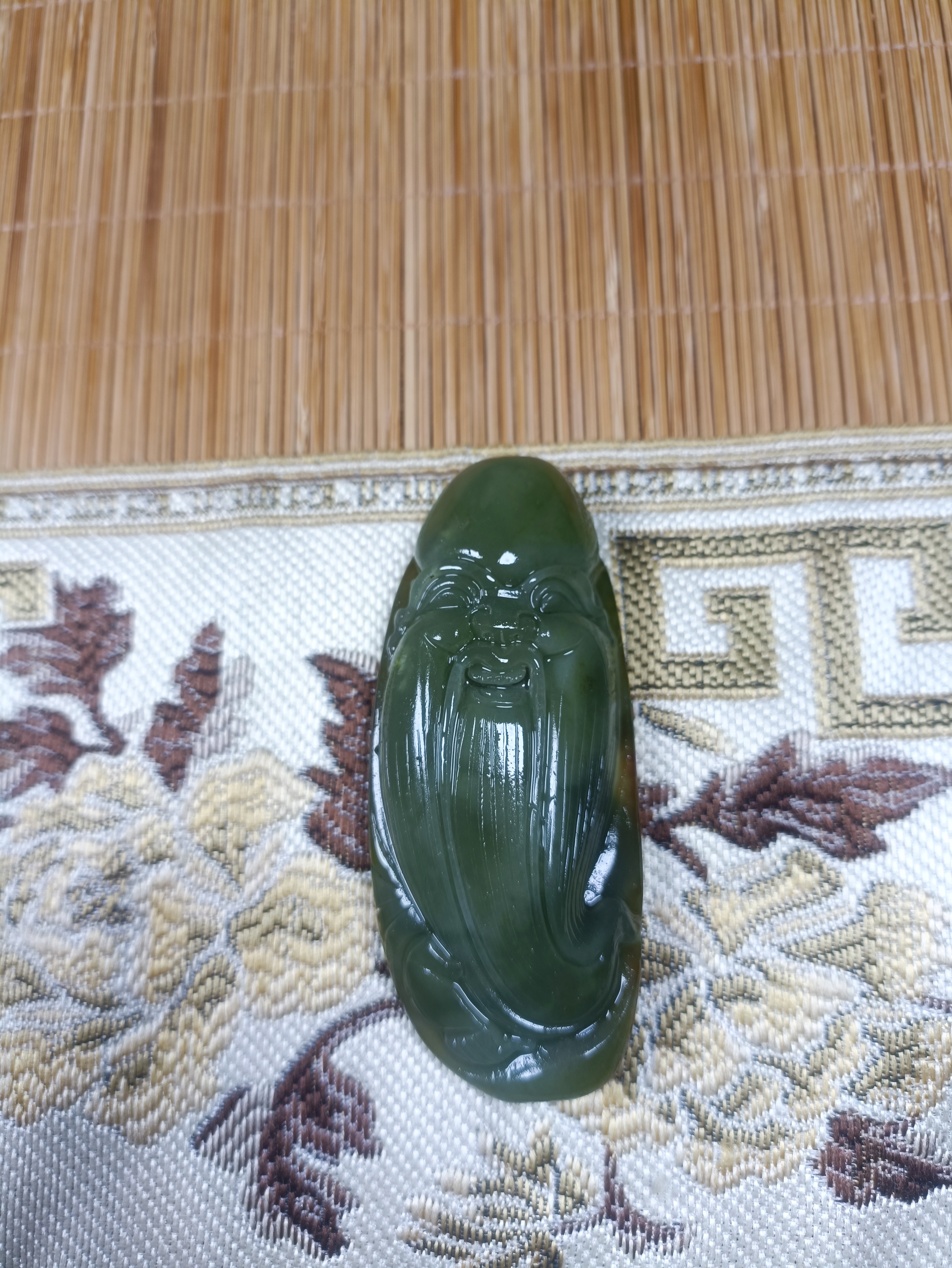 新疆和田玉青玉寿星手工雕刻手把件70克