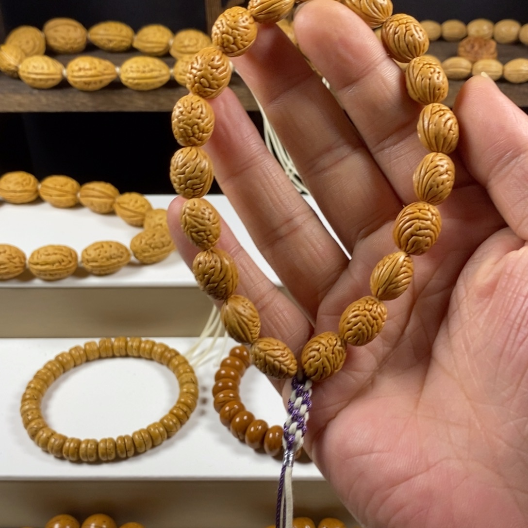 小***贝桃核吊坠沈阳钱袋子原皮手持