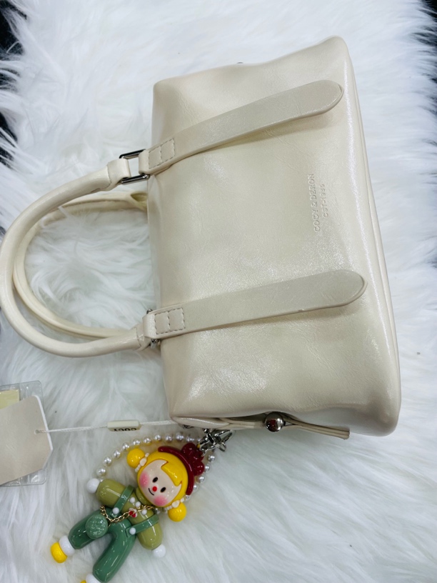 2025新款牛皮波士顿枕头包复古手提斜挎包百搭时尚通勤轻奢潮流包