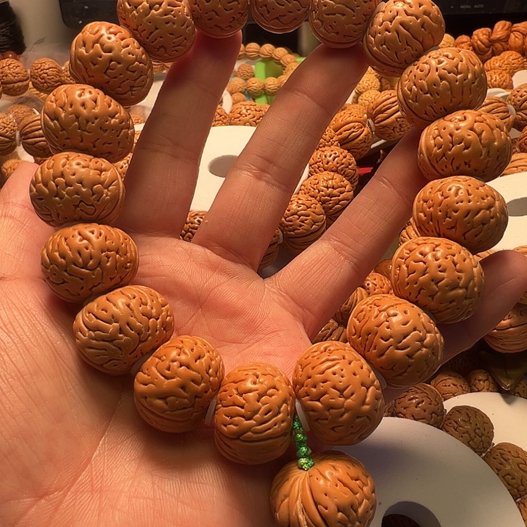 沐***、桃核手串磨盘手持22