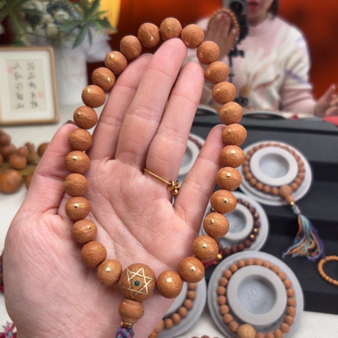 凤眼菩提吊坠12毫米手持铜27颗