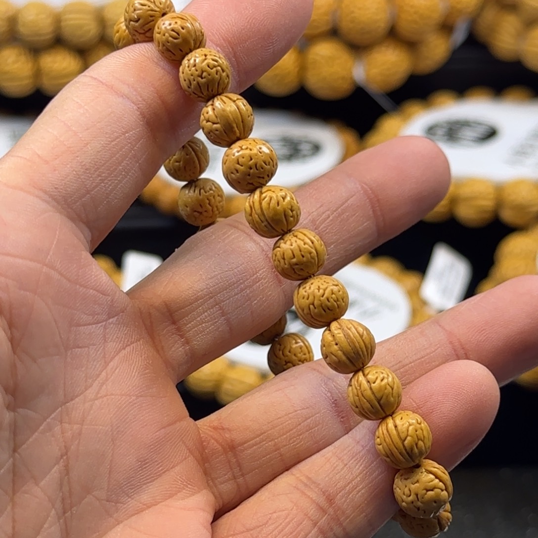 刘***鑫桃核手串精品盘锦0.9