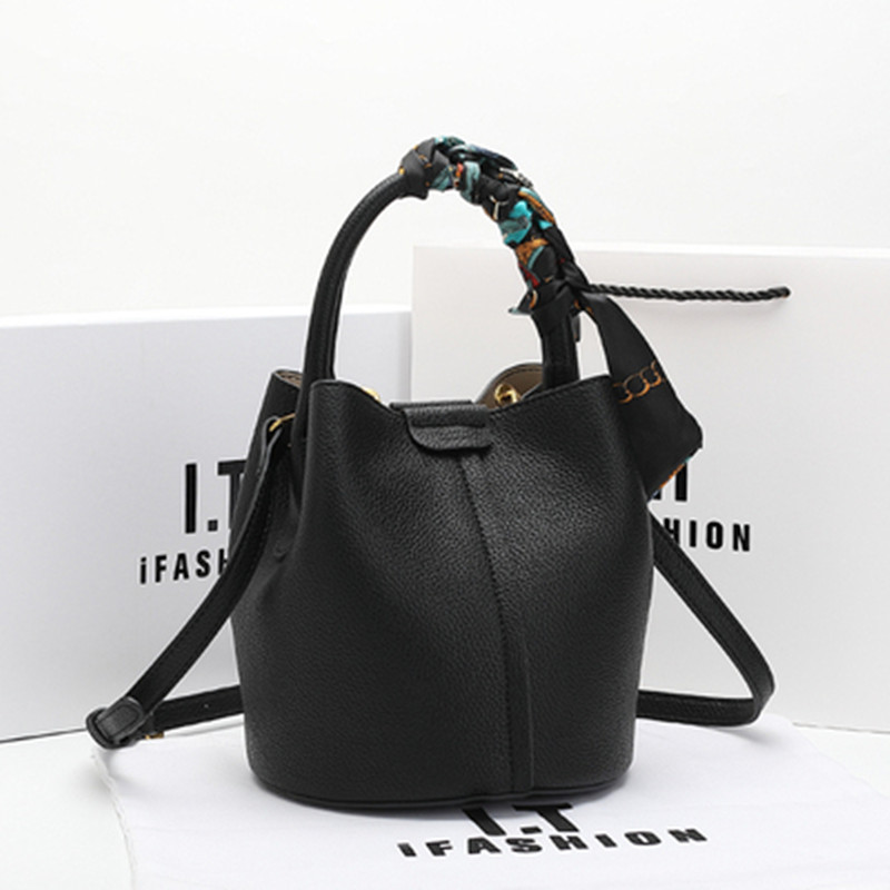 真皮时尚水桶包双根甜美风休闲磁扣斜挎包小众女士单肩包手提包