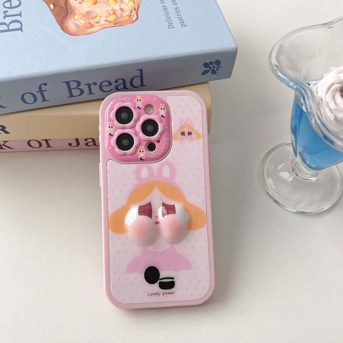 精孔花朵镜头少女心鼓包捏捏哭娃适用iPhone16Promax手机壳苹果1