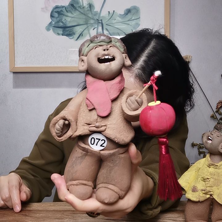 紫砂羲娲娃系列作品提灯笼男娃
