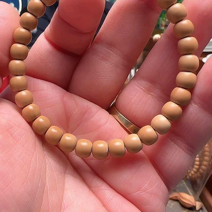 橄榄核手串相****)老挝核尖单圈6.9mm