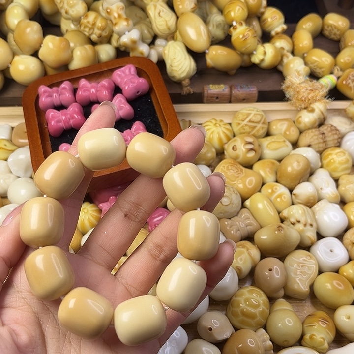 哲***儿吊坠菩提根/象牙果