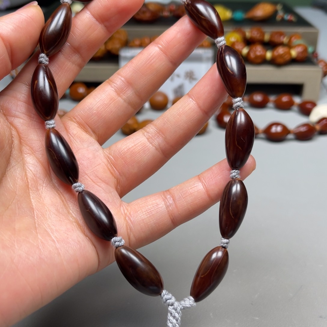 橄榄核吊坠紫皮手持