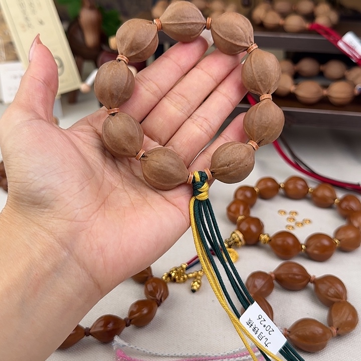 ****。橄榄核手串20*26三花核串