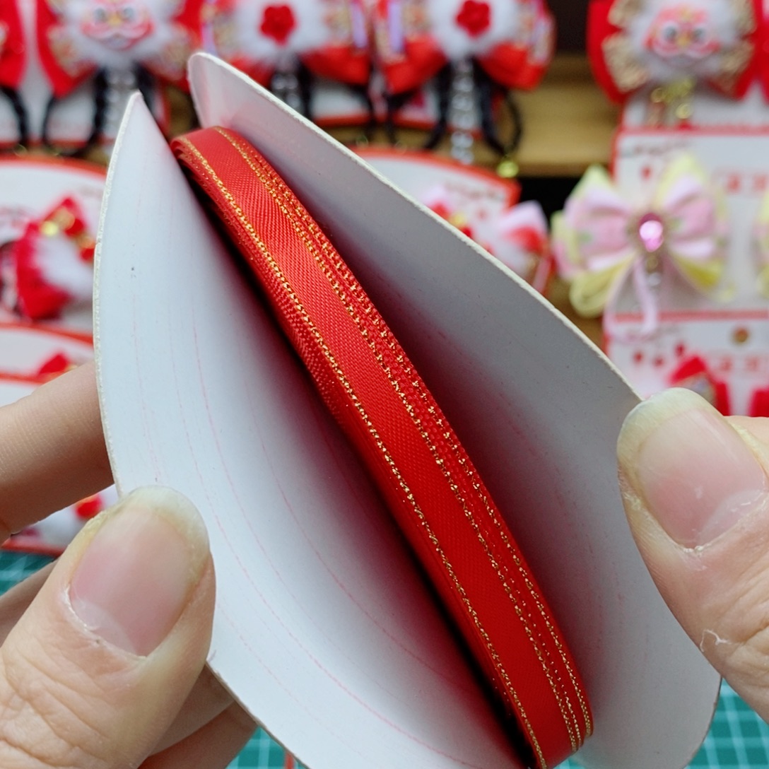 0.6金边涤纶带红色一卷50码