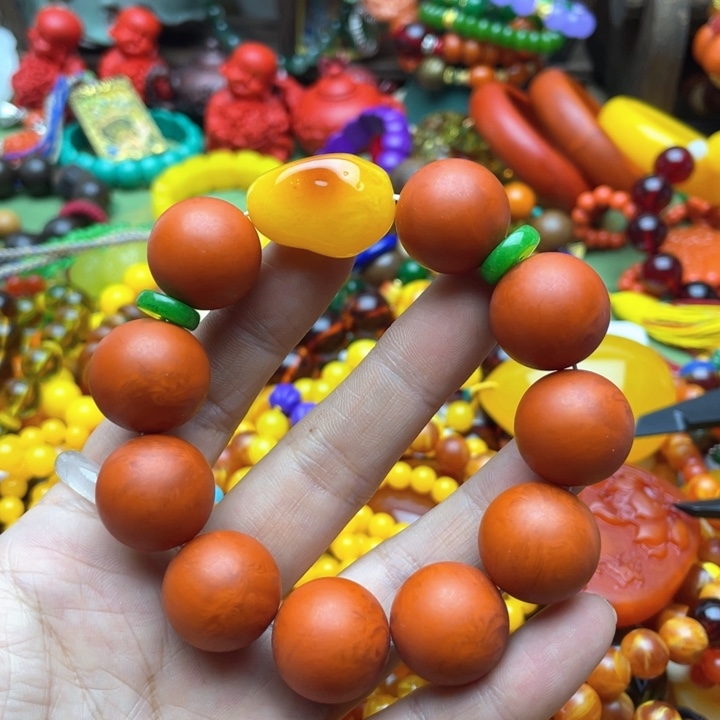 树脂制品开**敏90号橘色手串