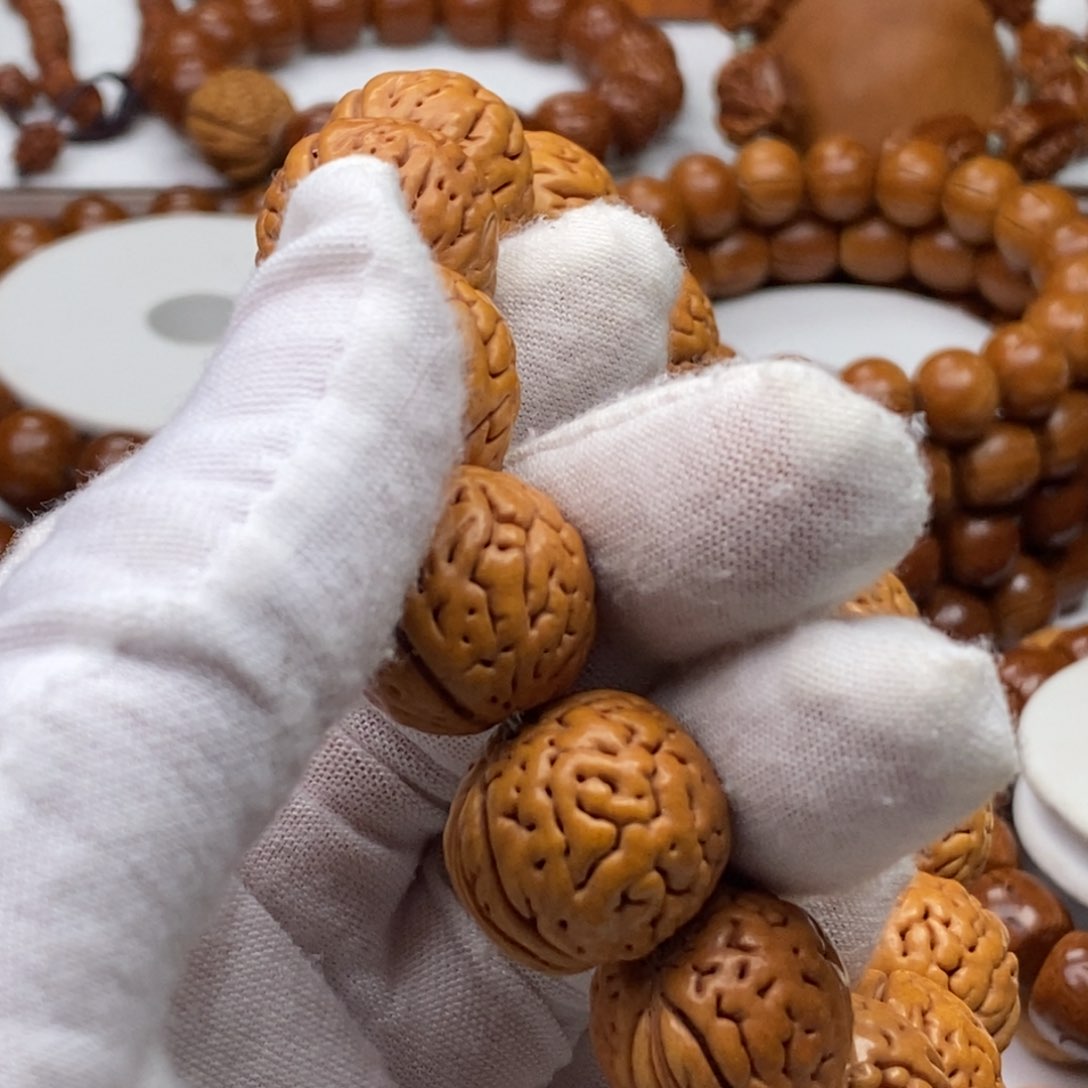 葒****?桃核纯手工制作工艺品