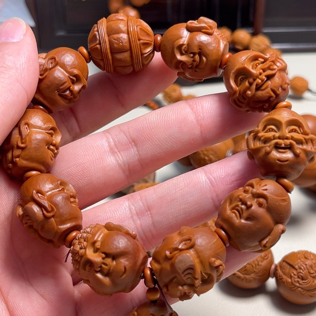 橄榄核吊坠别***谁殷派罗汉