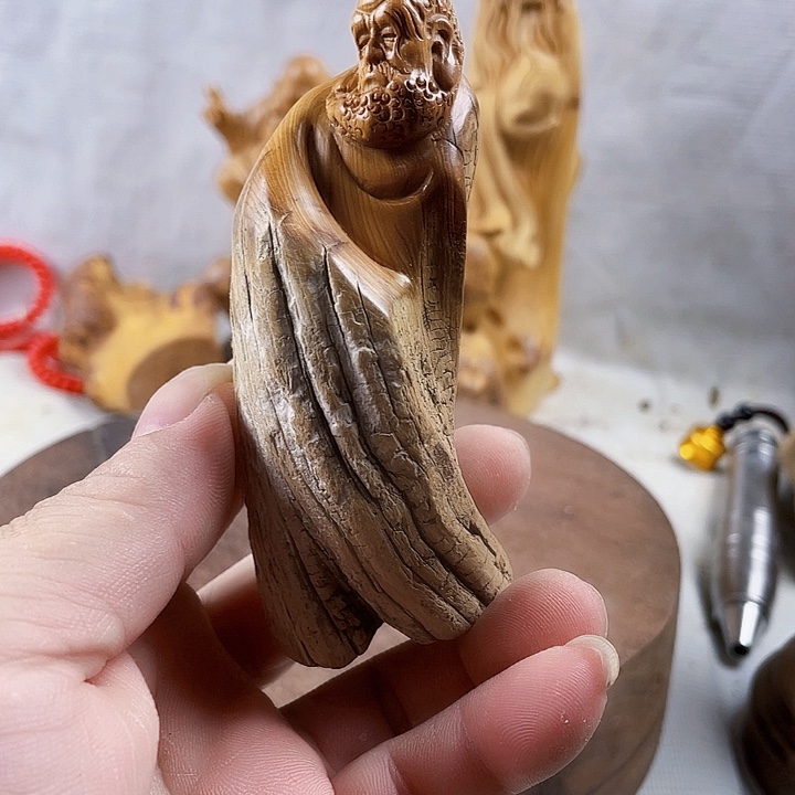牧***人柏木崖柏手把件达哥