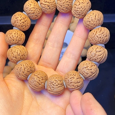 桃核吊坠努**搏桃核手串