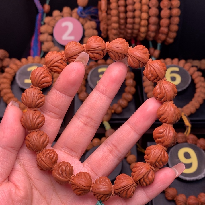 桃核吊坠十*1.5野生红魔手串