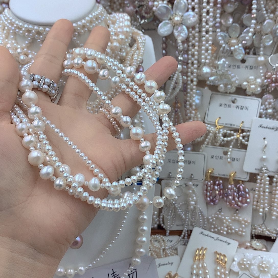 慕***哥银S925镶嵌淡水珍珠耳饰