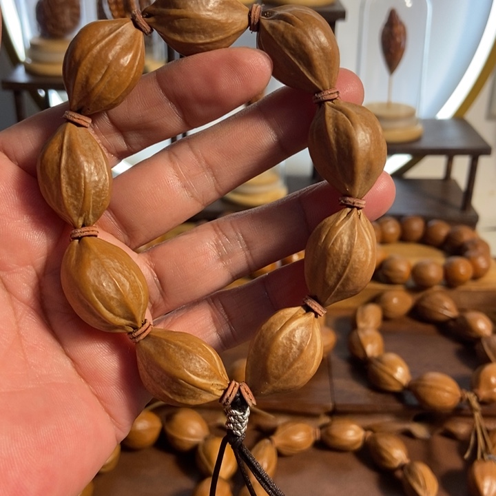 橄榄核吊坠18 x27四花梅林铁核