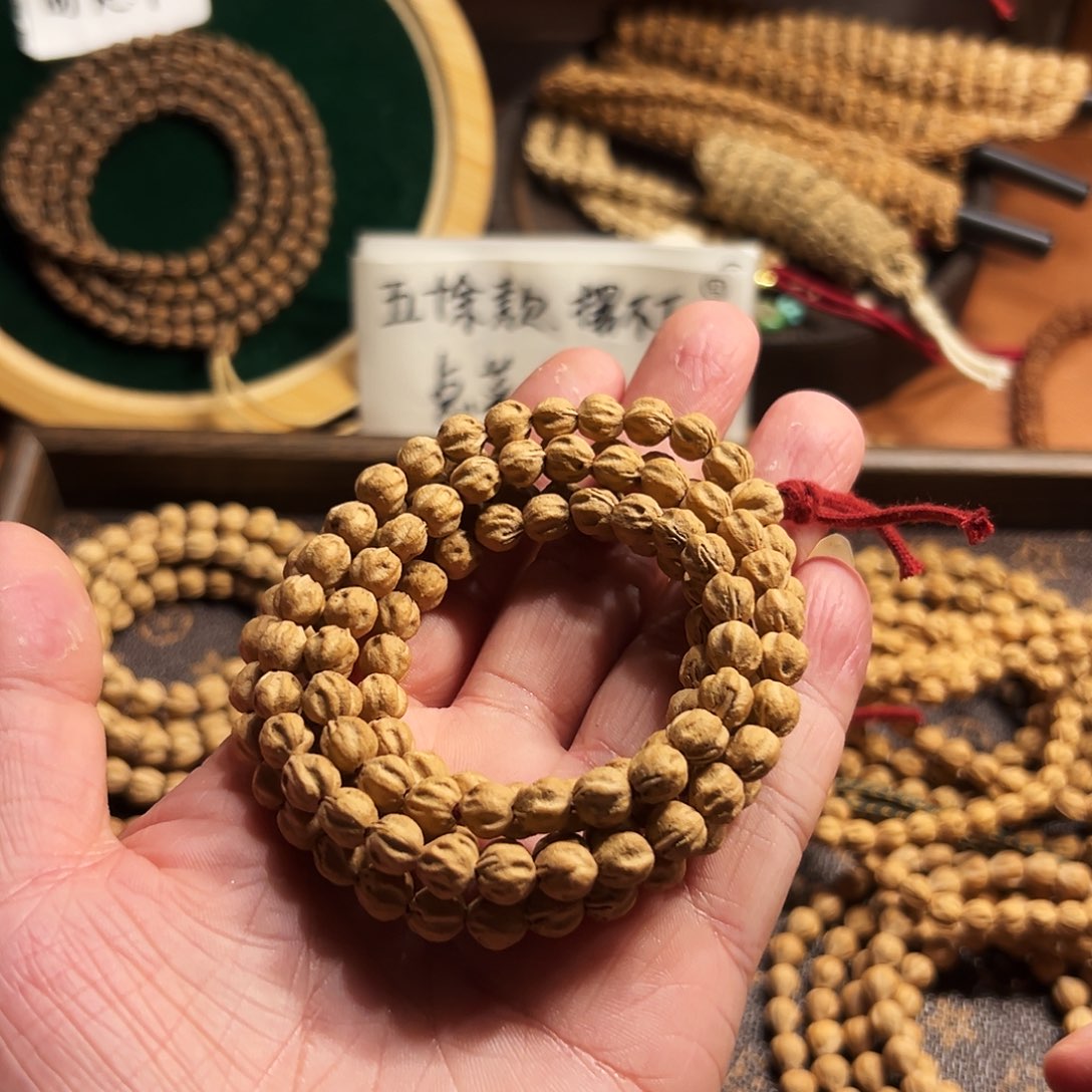 兰****柏香籽/百香籽吊坠原桩莲花