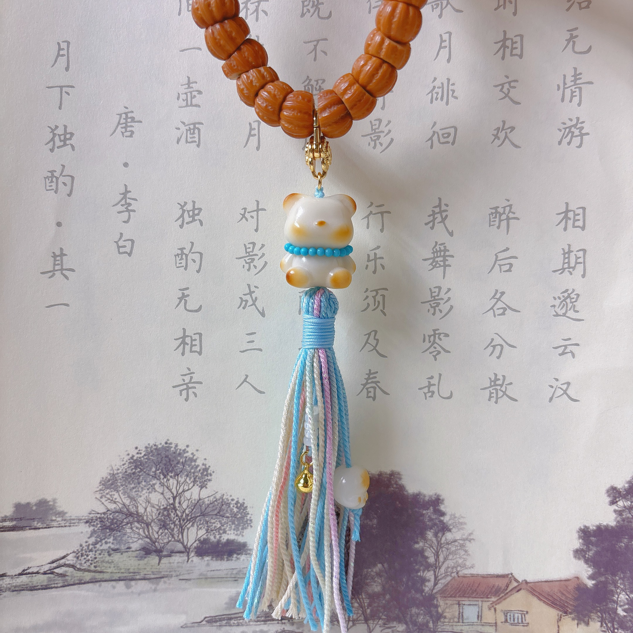 原创天然象牙果炭烤小熊提溜配长款流苏手持包挂万能扣小滴溜挂件