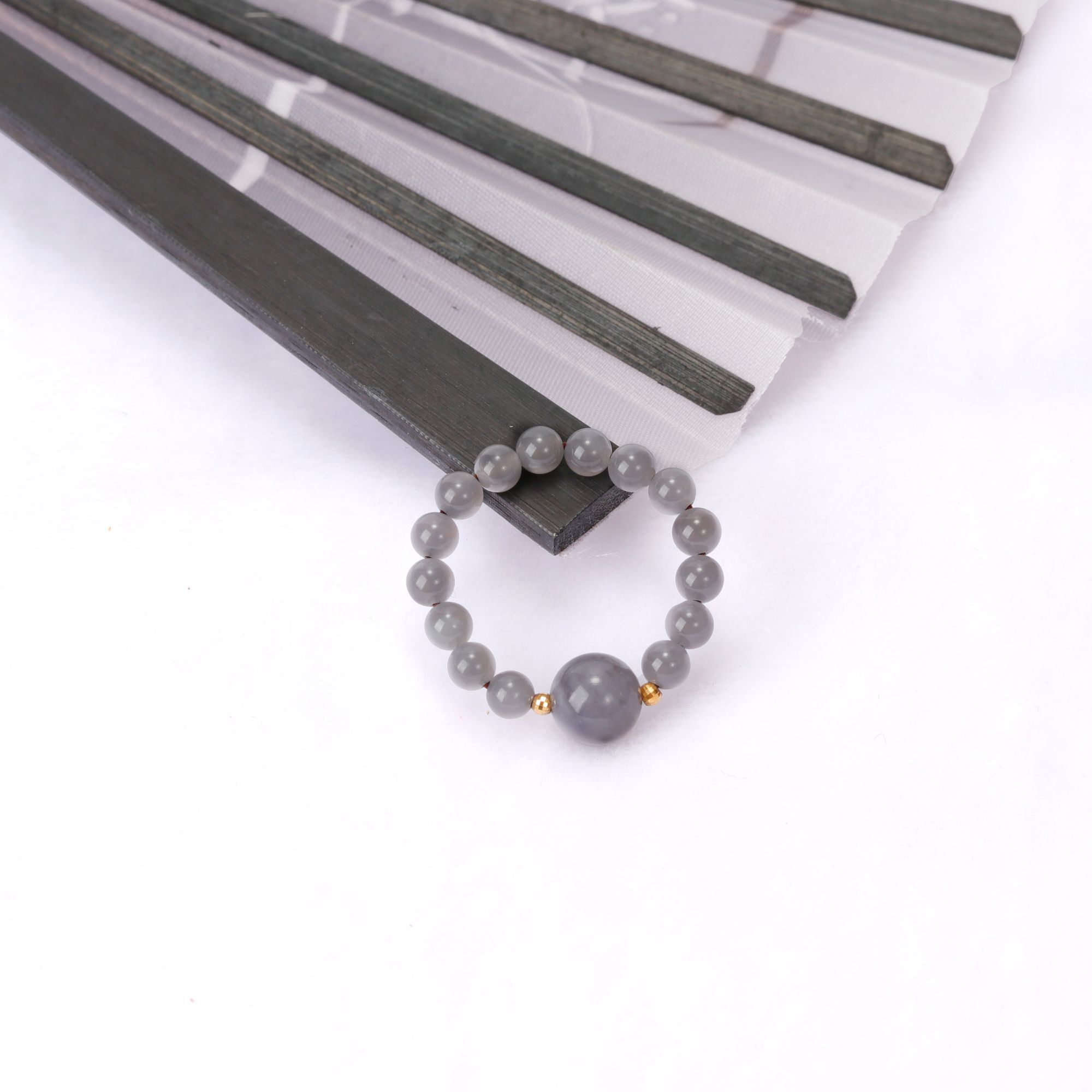 妙音宝玉18K金和田玉烟紫圆珠弹力绳戒指