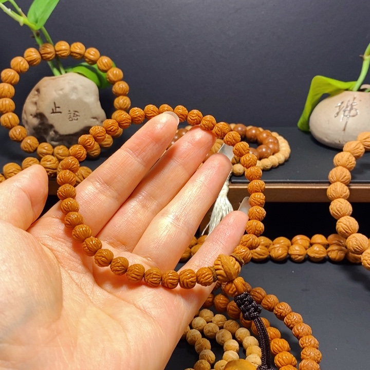 明***亮桃核手串野生凤羽手持