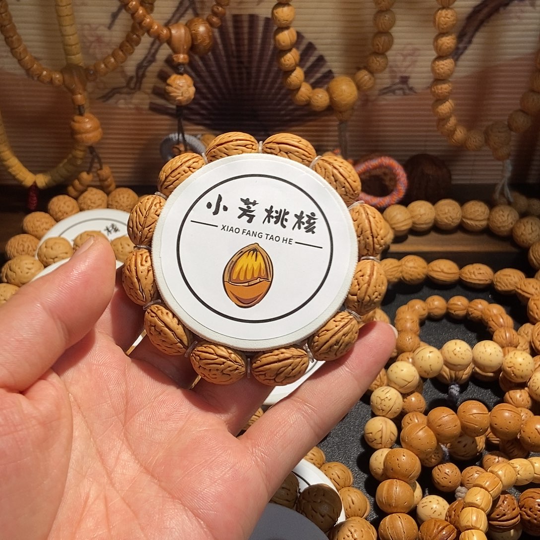 海***士手串桃核蜡皮钱袋子手串