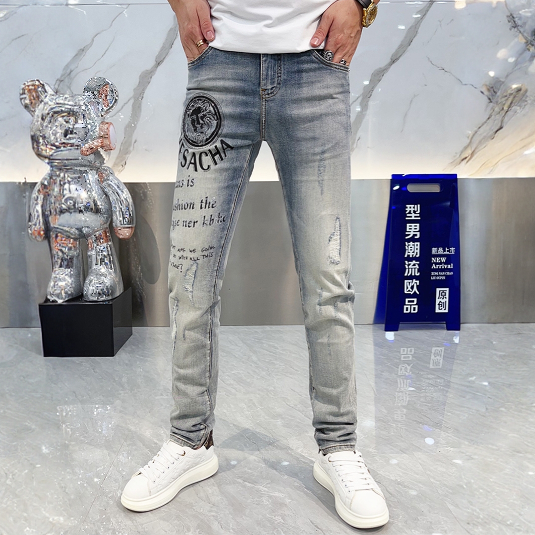 欧货高端潮牌牛仔裤男秋季薄款时尚徽章印花百搭修身小脚裤长裤男