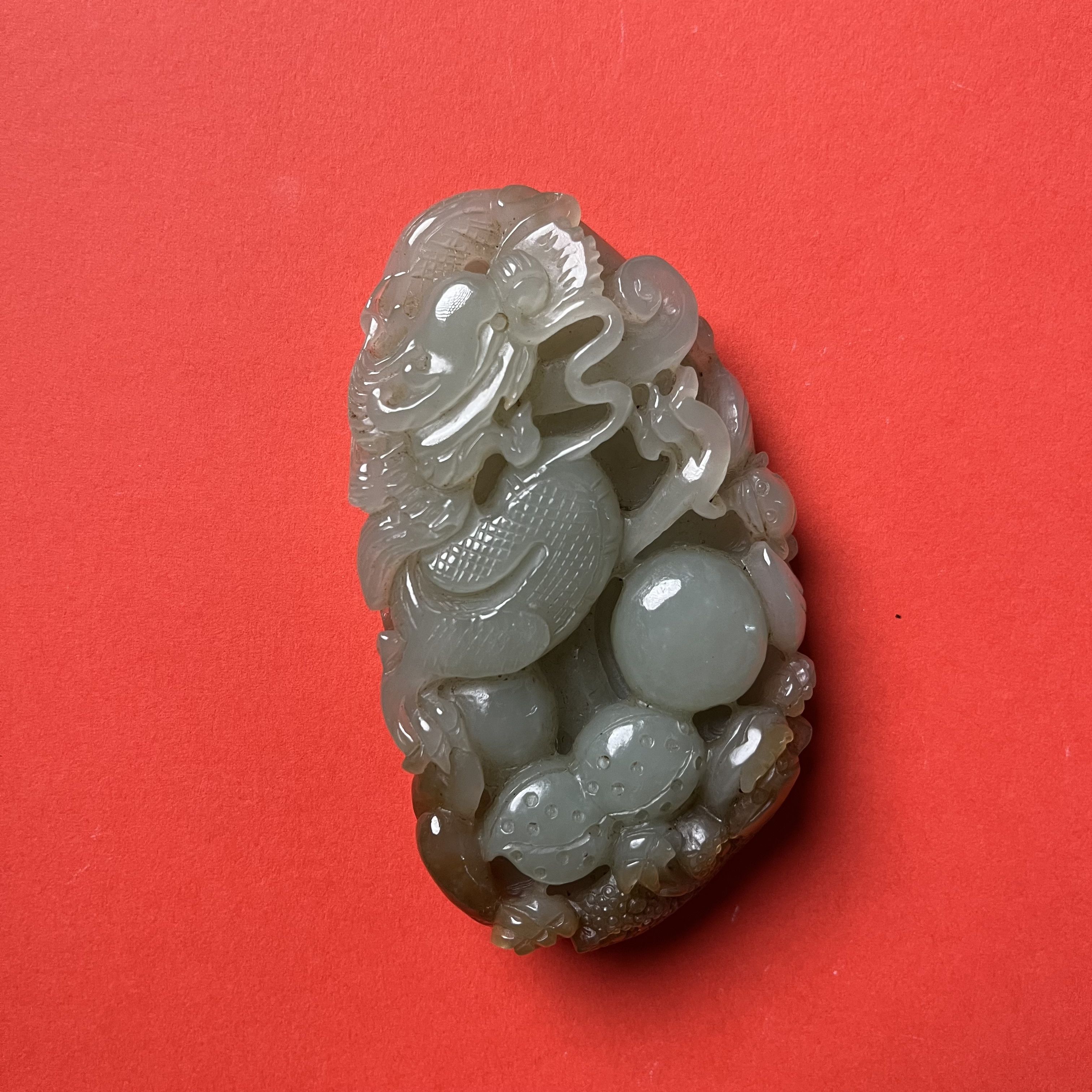 和田玉半过墙龙手把件 8022