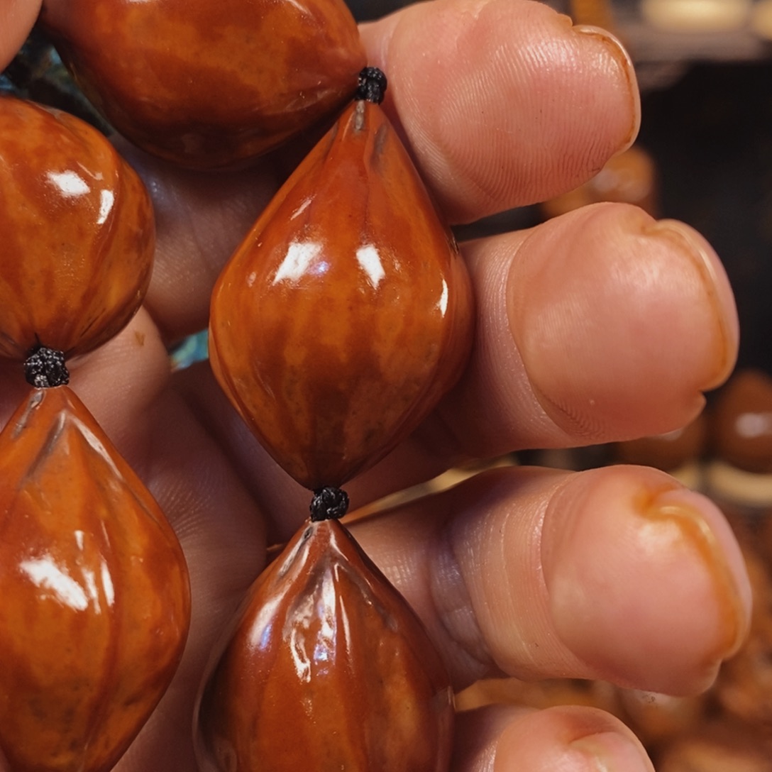 橄榄核吊坠难**涂铁核手串7777777