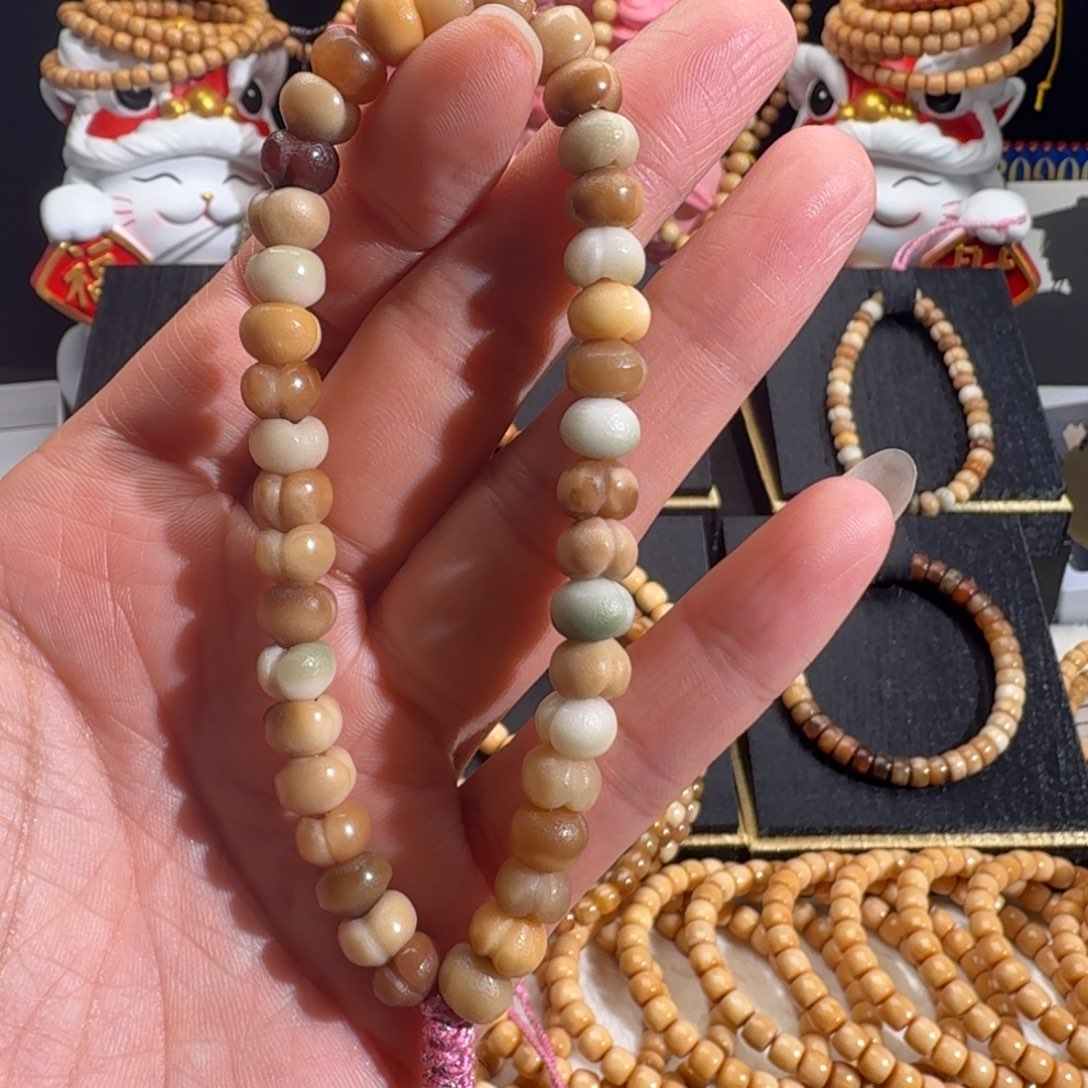 笑***笑龙脊菩提手串半玉化屁桃手持