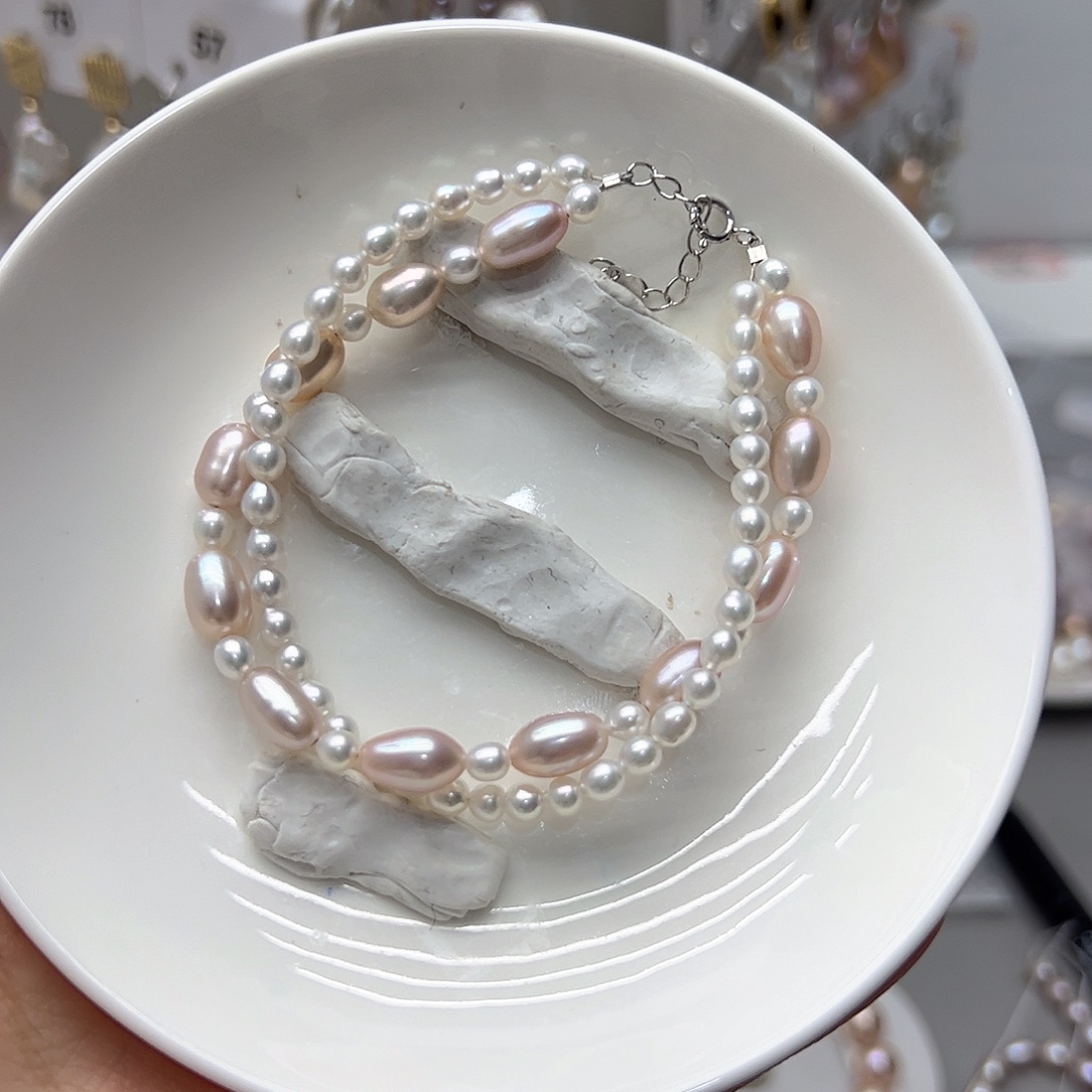 嫣***然耳饰银S925镶嵌淡水珍珠