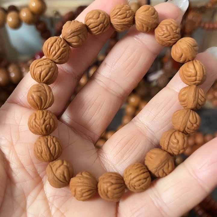 郭***戈把件核桃野生桃枭小籽手串