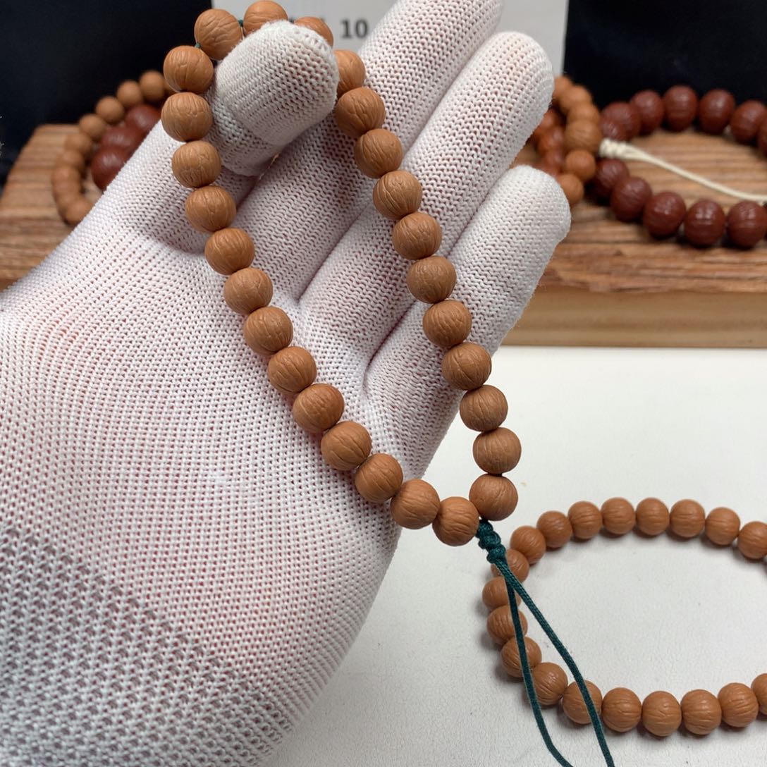 托***雷吊坠猴头核桃凤羽