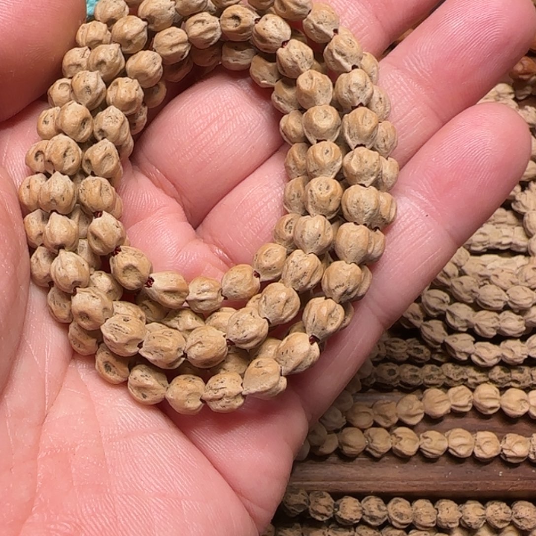 弓***石柏香籽/百香籽吊坠