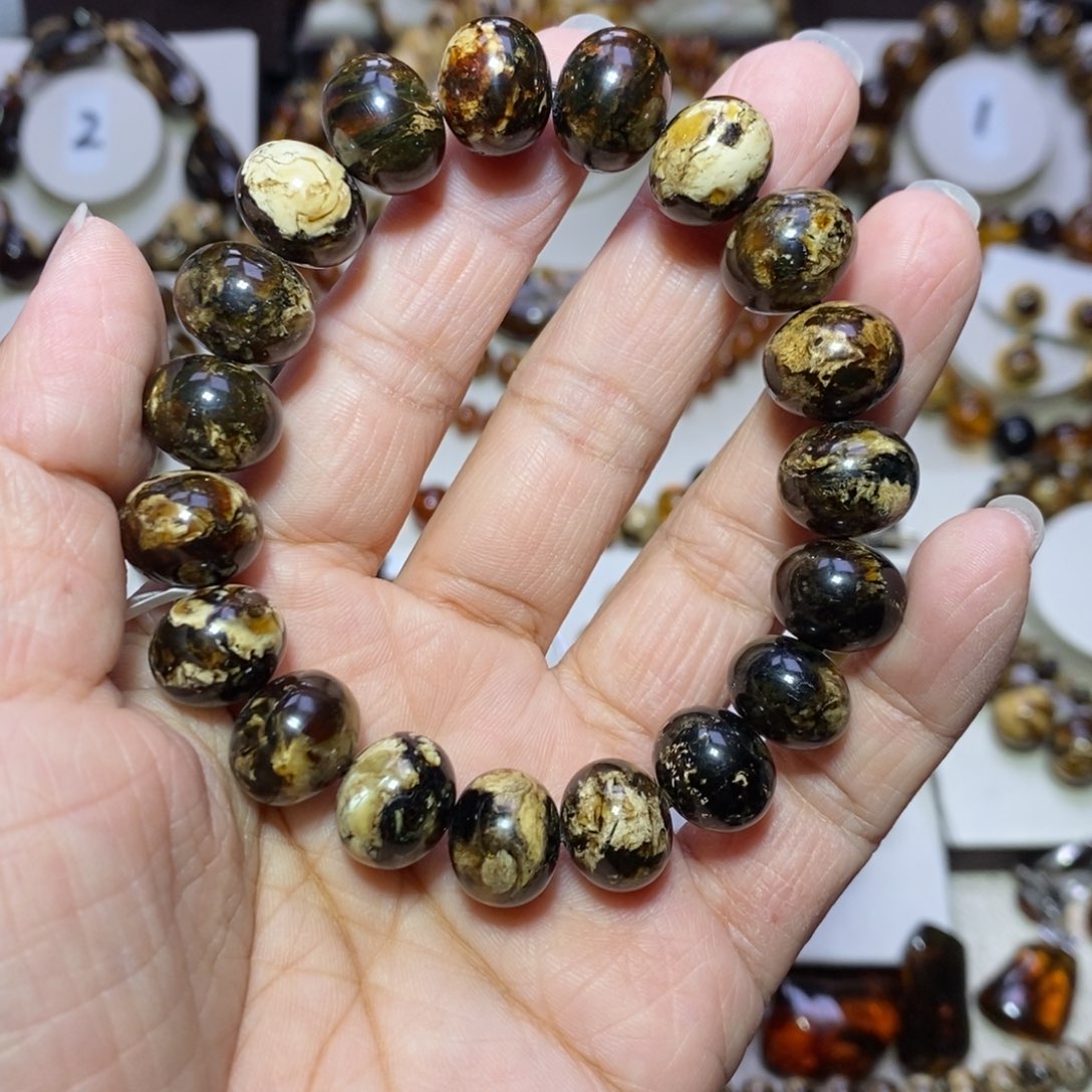 大***哥琥珀未镶嵌裸石熊猫花13m