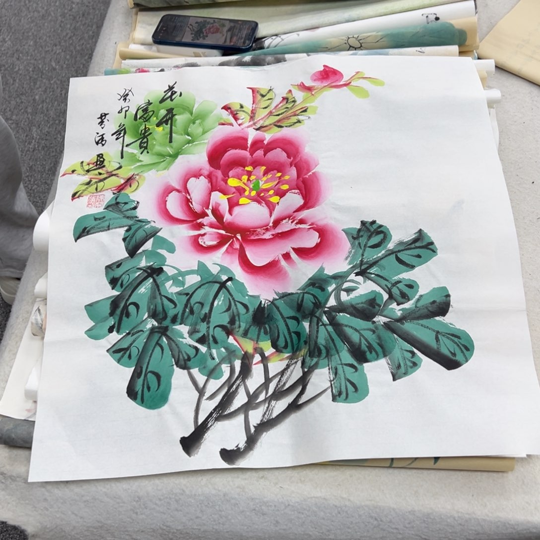 国画卖字画的小男孩