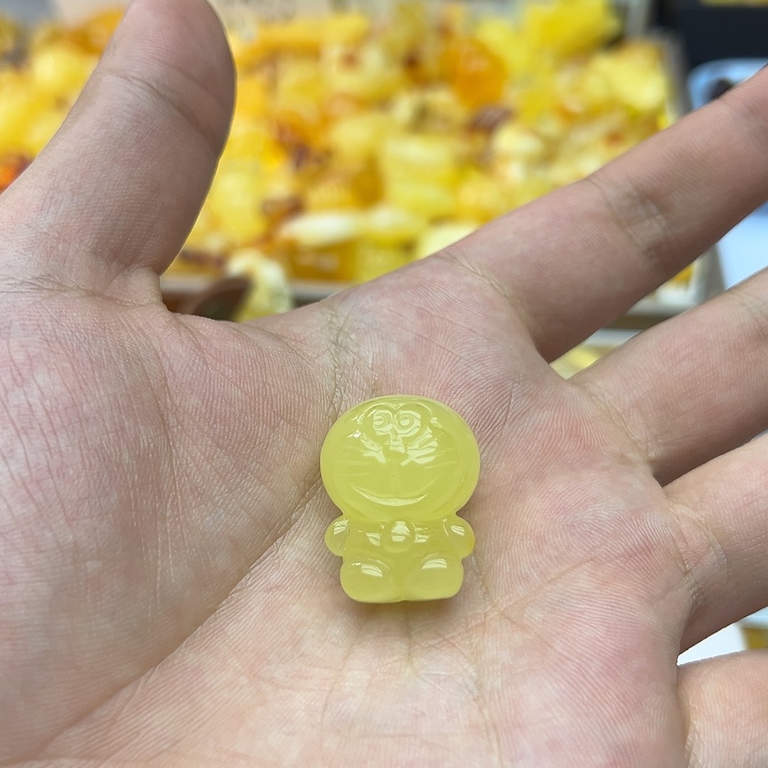 -****琥珀未镶嵌裸石蜜蜡机器猫4.99g