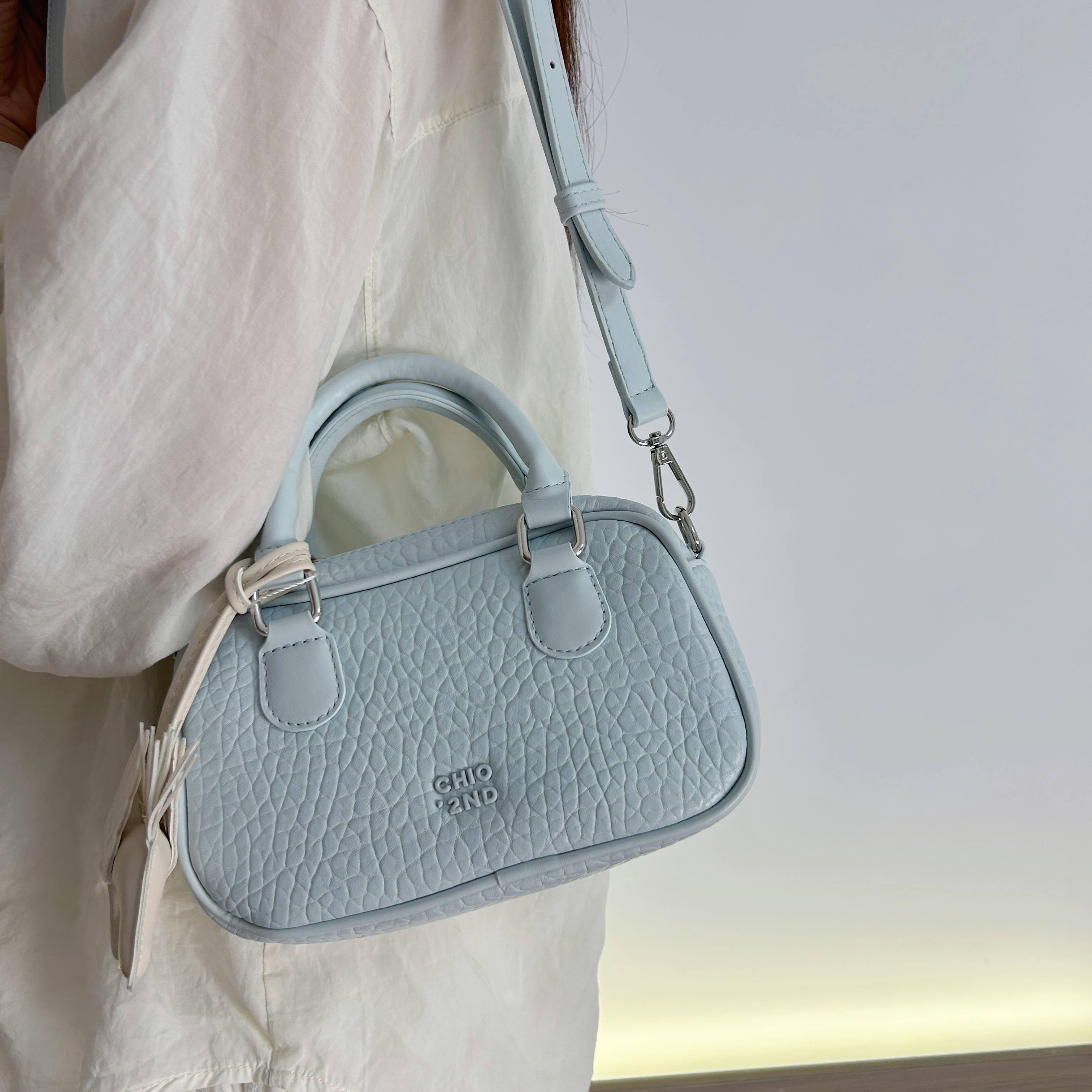 南家百搭冰蓝春野休闲枕头包包女2025超火波士顿手提包斜挎小包