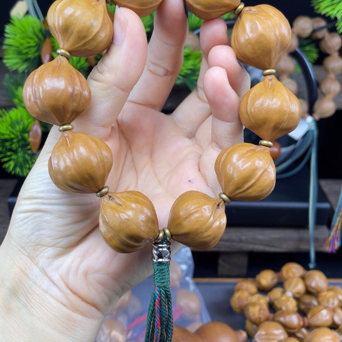 小***ゞ吊坠橄榄核001铁核四花2.5