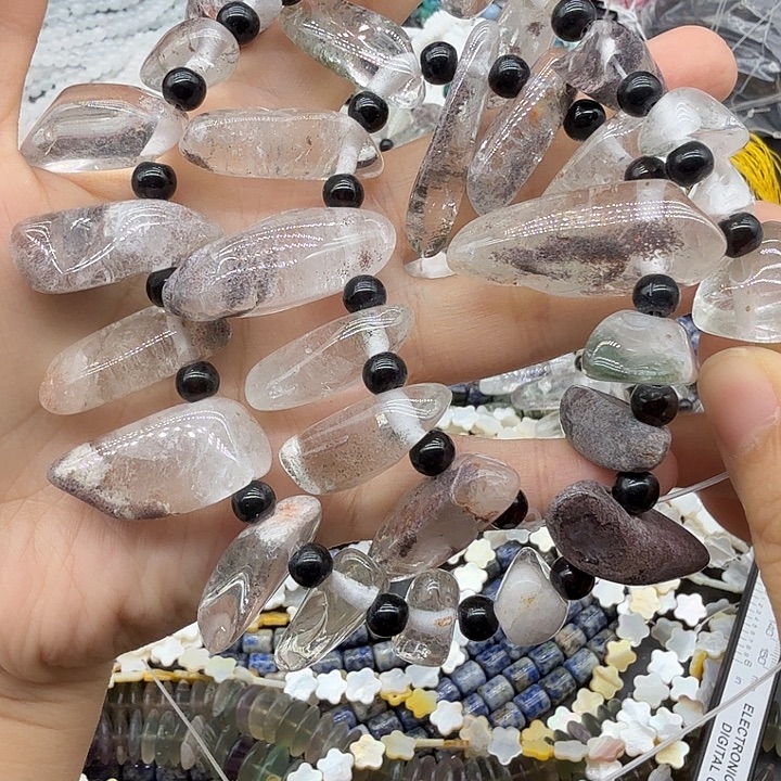 未镶嵌珠宝半成品水晶红皮幽灵长牙一条