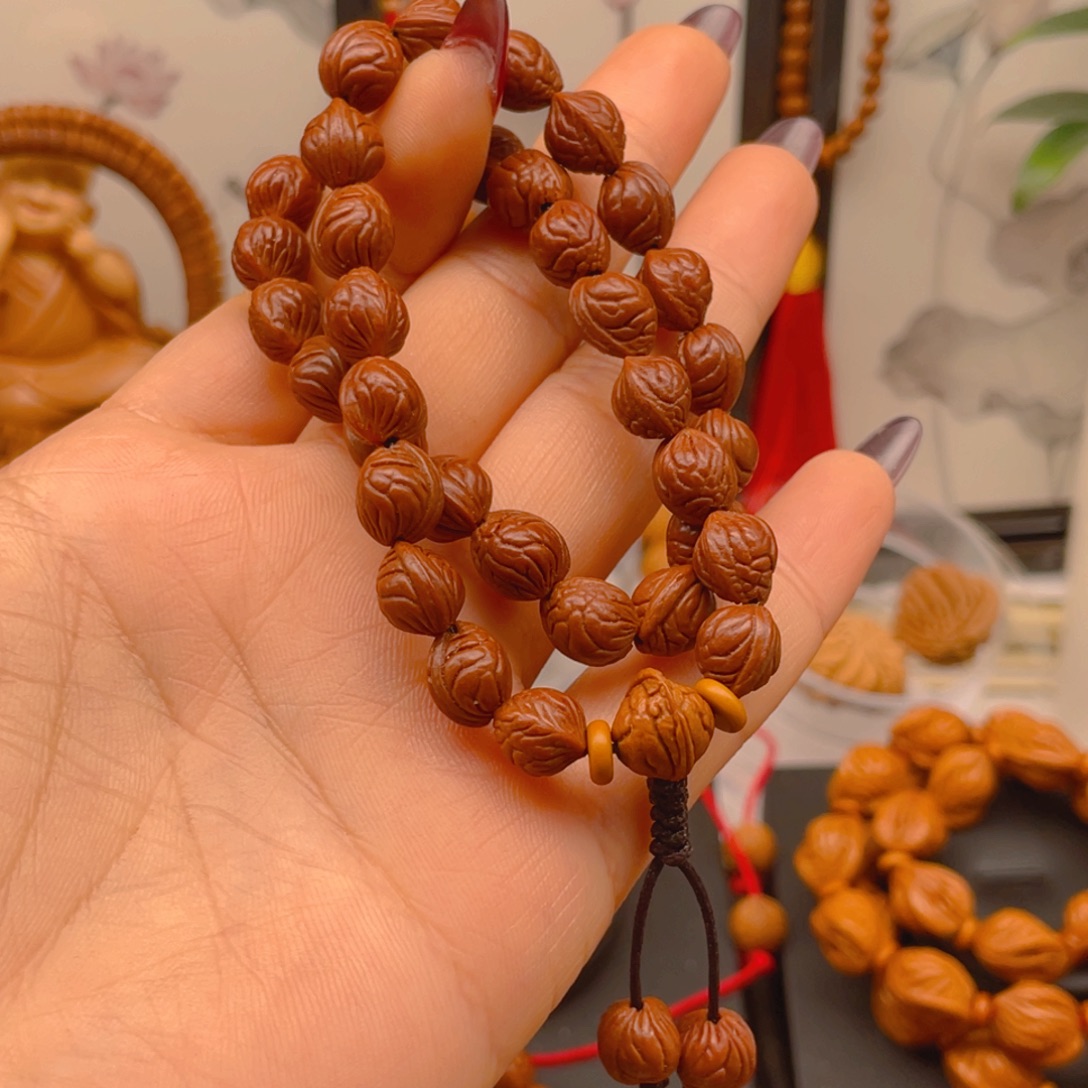 扫***森手串桃核红红火火。红红火火