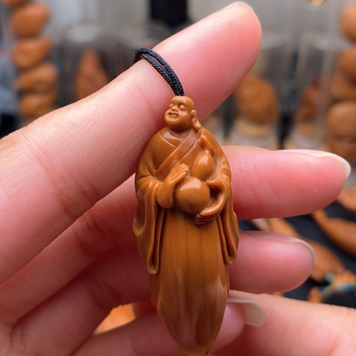 山***纸橄榄核吊坠弥勒佛