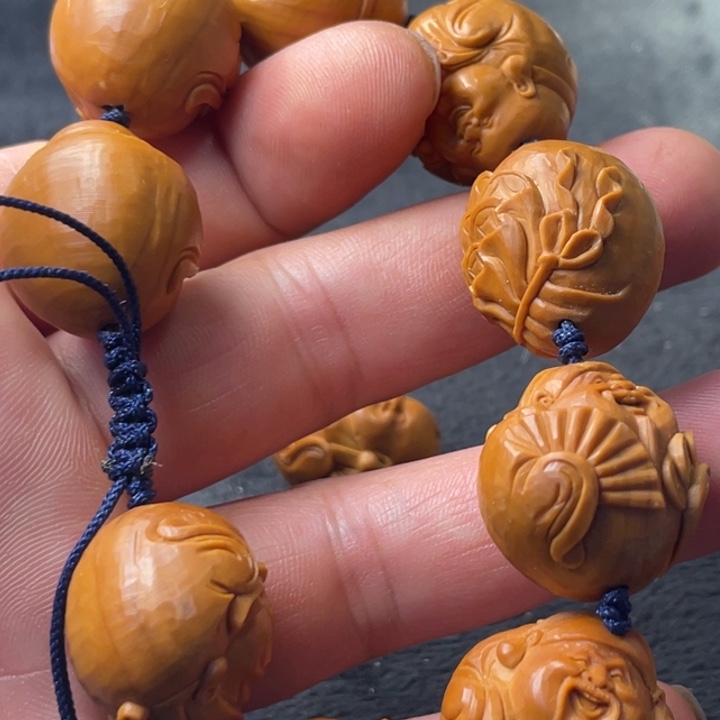 橄榄核吊坠包衣财迷