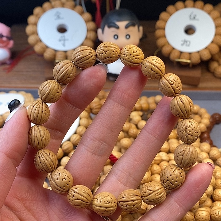 桃核手串凤羽12  （尺寸误差0.5之间）