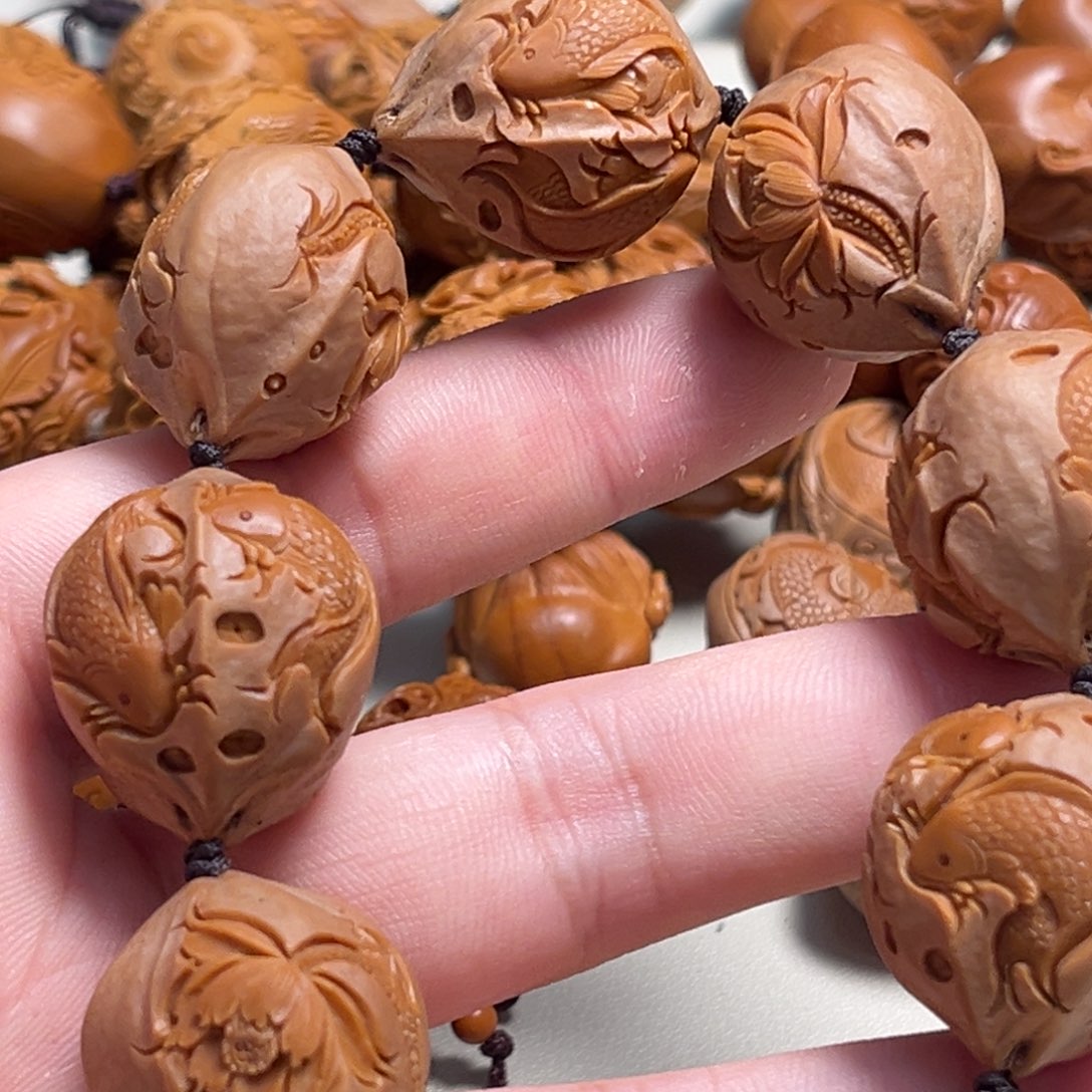 橄榄核吊坠小****爷荷花鱼