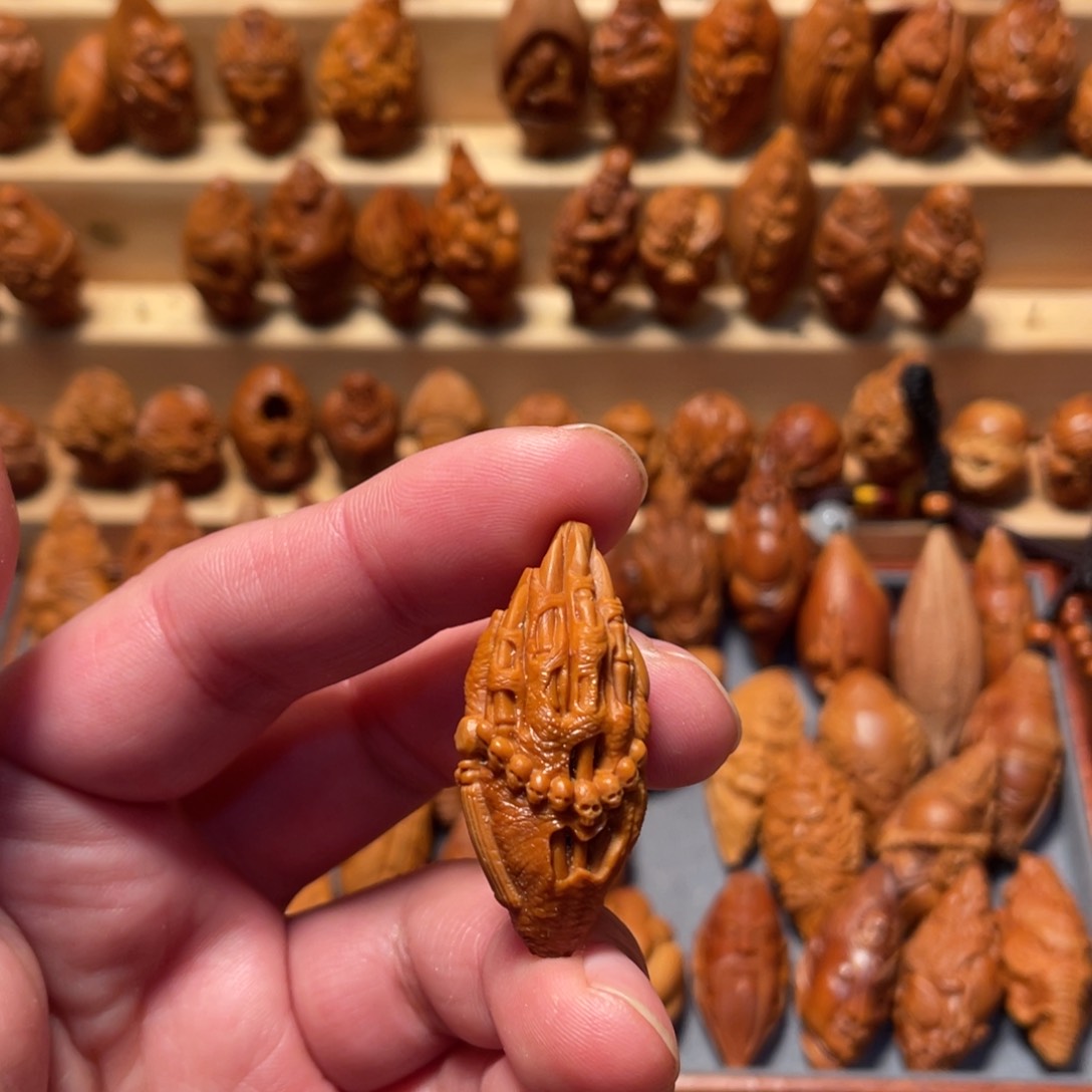 橄榄核把件佛魔手