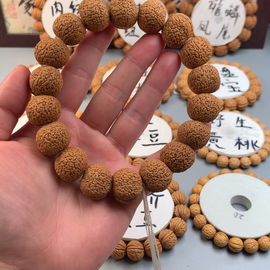 桃核手串龙鳞凤尾